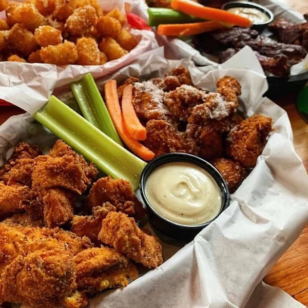 Dirty Birds wings, tenders, tots, vegetables, and dipping sauces