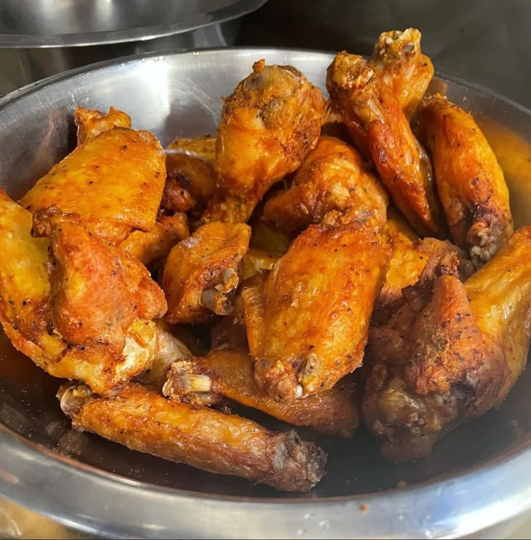 Glazed Dirty Birds chicken wings in a metal bowl